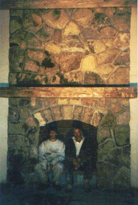 Tom and Tom in a Large Fireplace
